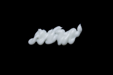 white beauty cream on black background