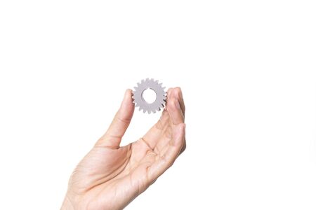 woman holding gear on white backgroundの写真素材