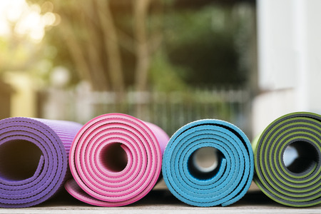 yoga mat on wooden tableの写真素材