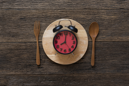 Food clock. Healthy food concept on wooden tableの写真素材