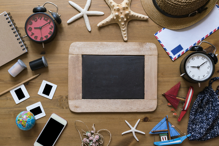 travel planning on wooden table backgroundの写真素材