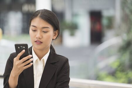 Close up of businesswomen using smartphone, business concept