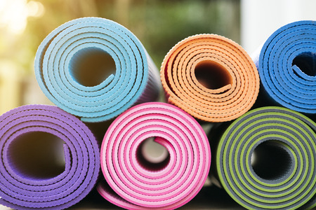 close up colorful of yoga mats in the gardenの写真素材