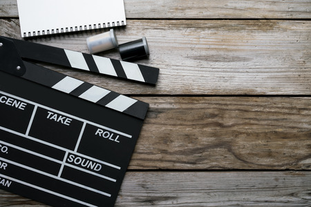 movie clapper on wood table ; film, cinema and video photography conceptの写真素材