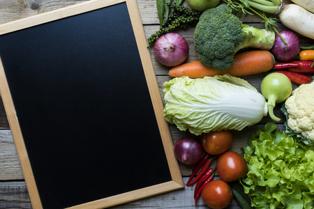 Fresh farmers market fruit and vegetable from above with blackboardの写真素材