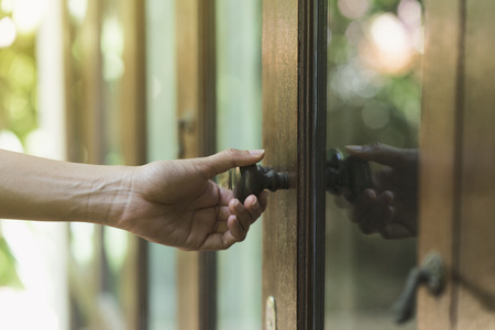 hand hold handle of door, close upの写真素材