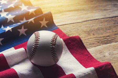 baseball with American flag in the backgroundの写真素材