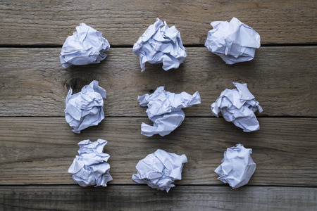 collection of various crumpled paper on wood table background の写真素材