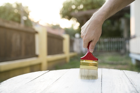 Applying protective varnish on a wooden texture, diy and repair house equipment conceptの写真素材