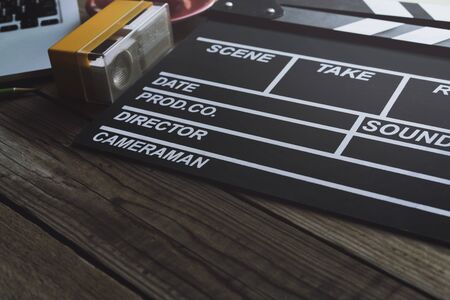movie clapper on wood table ; film, cinema and video photography conceptの写真素材