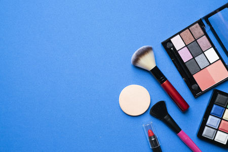 Set of colorful cosmetics on blue backgroundの写真素材