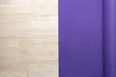close up of purple yoga mat on the table, sport and healthy conceptの写真素材