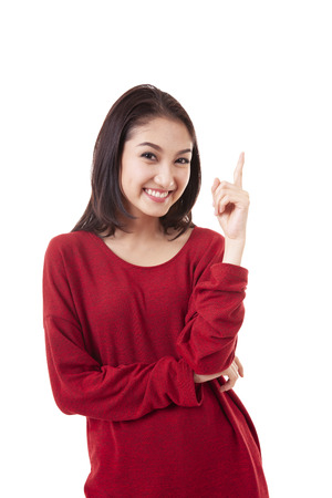 Portrait beautiful asian girl woman has an idea and pointing up on white backgroundの写真素材