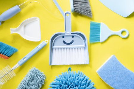 House cleaning product on yellow table background
