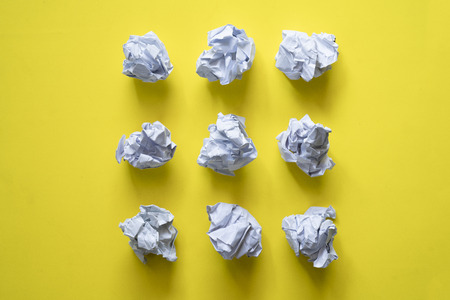 collection of various crumpled paper on yellow backgroundの写真素材