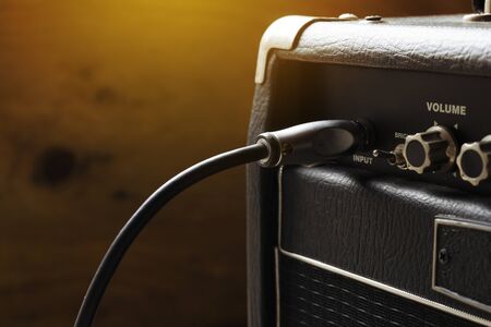 close up of guitar amplifier and  guitar jack, music concept