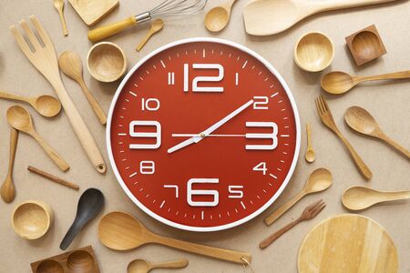 Food clock spoon and fork, Healthy food concept on table backgroundの写真素材