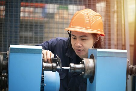 young asian woman engineer set up and testing machine in the laboratory factory, engineering and...