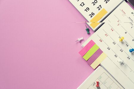 close up of calendar on the pink table background, planning for business meeting or travel planning conceptの写真素材