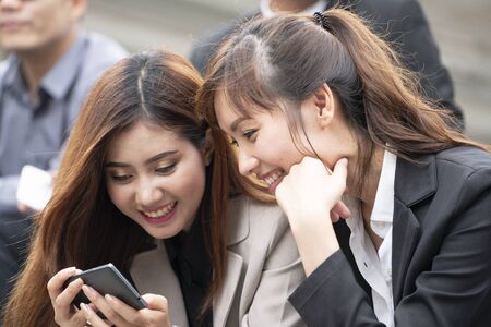 Close up of asian women or businesswomen using smartphone , business and communication conceptの写真素材