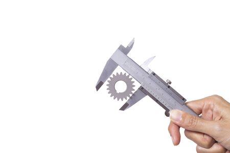 close up hand of woman use vernier to measure gear on white background, engineering and industry equipment conceptの写真素材