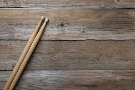 Drum stick on wooden table background, top view, music conceptの写真素材