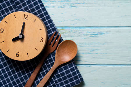 Food clock. Healthy food concept on green table backgroundの写真素材