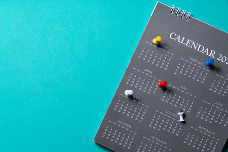 close up of calendar on the green table background, planning for business meeting or travel planning conceptの写真素材