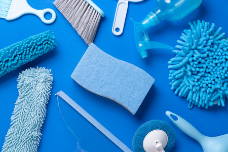 House cleaning product on blue table background, housekeeping and home service conceptの写真素材