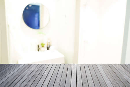 Empty top of wooden table and bathroom blur background for present or show your productの写真素材