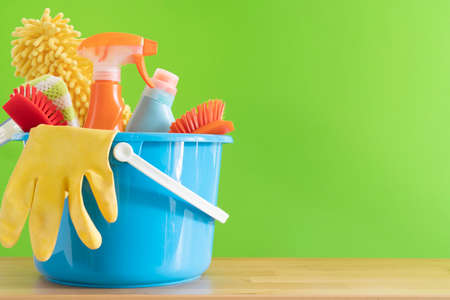 House cleaning product on wood table with green background, home service or housekeeping conceptの写真素材