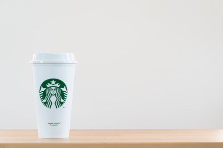 Bangkok, Thailand - march 21, 2021: Close up a white reusable Starbucks coffee cup on the table with white backgroundのeditorial素材