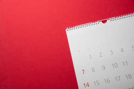 close up of calendar on the red table background, planning for business meeting or travel planning conceptの写真素材