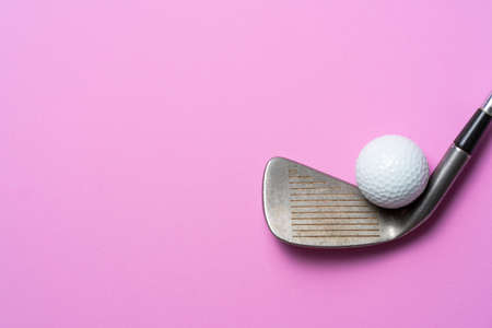 golf ball and golf club on pink backgroundの写真素材