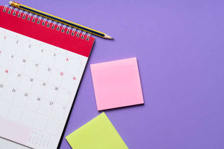 close up of calendar on the purple table background, planning for business meeting or travel planning conceptの写真素材