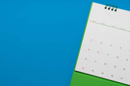 close up of calendar on the blue table background, planning for business meeting or travel planning...