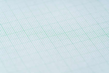 close up of green graph paper, research and education concept