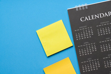 close up of calendar on the blue table background, planning for business meeting or travel planning conceptの写真素材