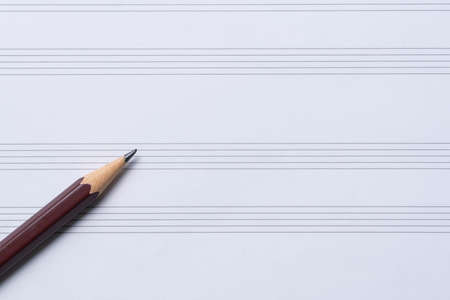 close up of pencil on music sheet on the tableの写真素材