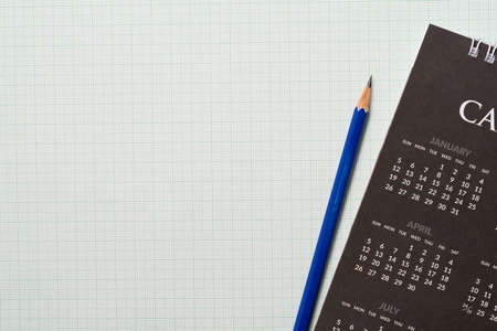 close up of calendar and pencil on the paper graph background, planning for business meeting or engineering education planning conceptの写真素材