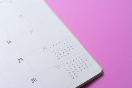 close up of calendar on the pink table background, planning for business meeting or travel planning conceptの写真素材