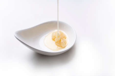 condensed milk isolated on a white background, food and dessert conceptの写真素材
