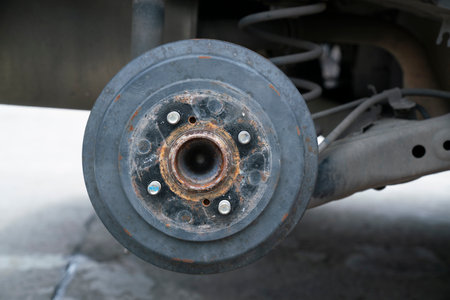 Car Break detail and car jack with tire removed