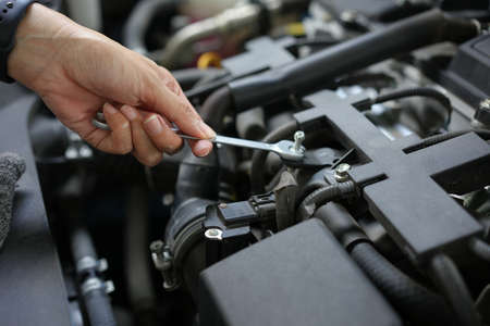 Technician engineer check the engine car daily, maintenance and repair concept