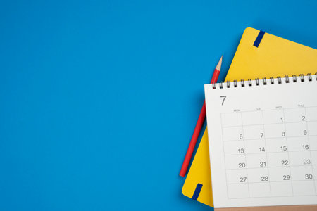 close up of calendar on the blue table background, planning for business meeting or travel planning conceptの写真素材
