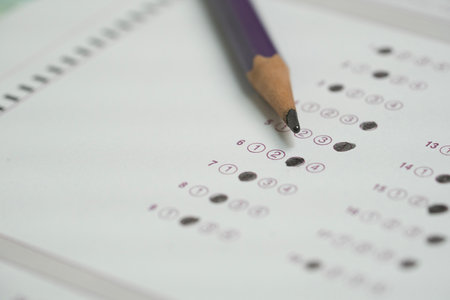 close up pencil on answer sheets, education concept