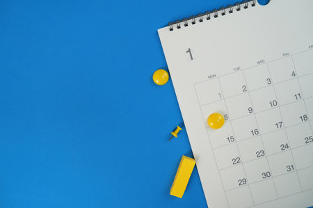 close up of calendar on the blue table background, planning for business meeting or travel planning conceptの写真素材