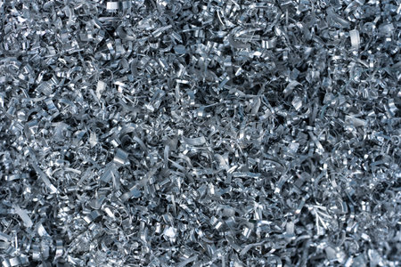 Closeup twisted spiral steel or aluminum metal shavings and cutting, industrial material recycle...
