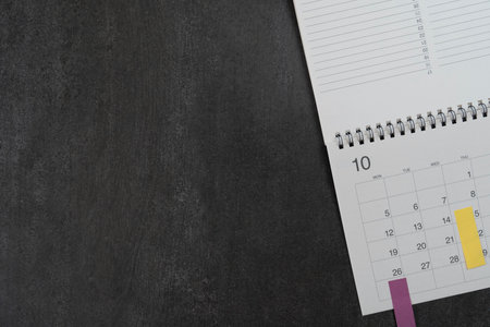 close up of calendar on the black table background, planning for business meeting or travel planning conceptの写真素材