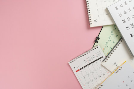 close up of calendar on the pink table background, planning for business meeting or travel planning conceptの写真素材